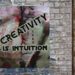 A painting that says "Creativity is intuition"