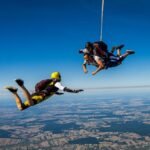 3 people parachuting