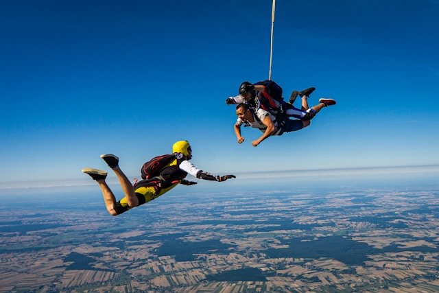 3 people parachuting